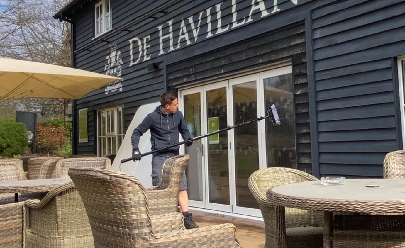 Pure-water-fed pole cleaning a sash window on a Maidenhead home